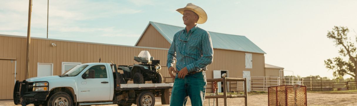 Beef cattle farmer in front of truck - Zoetis