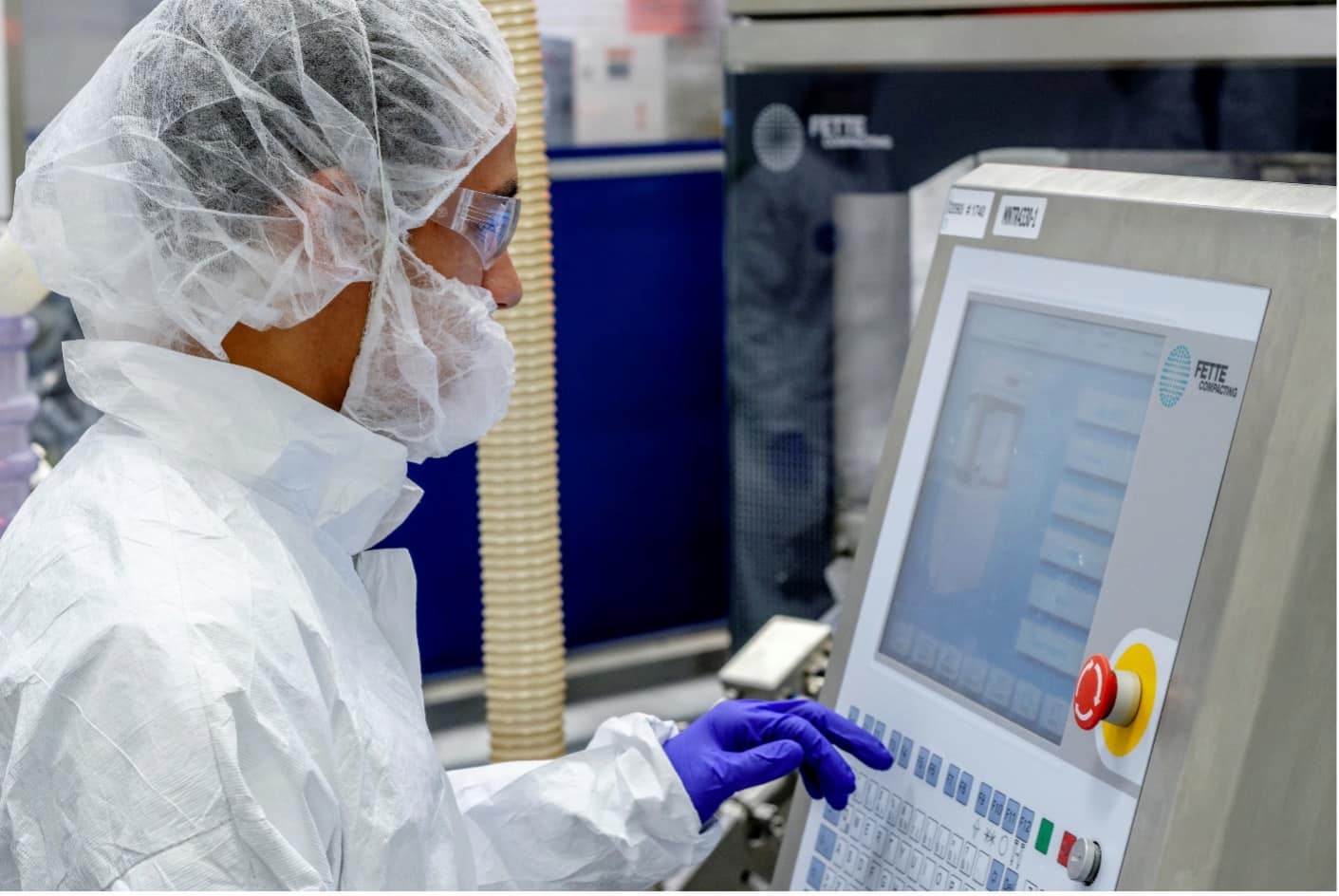 Zoetis technician working at screen in lab